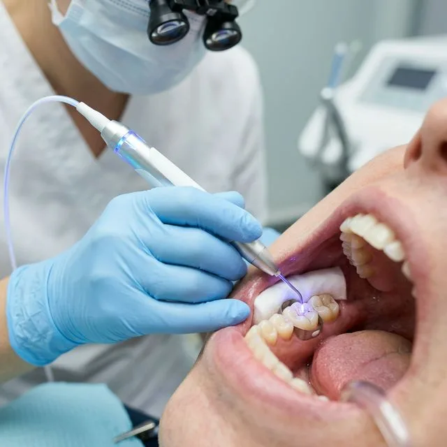 Advanced comfortable laser dentistry being used to treat a tooth infection